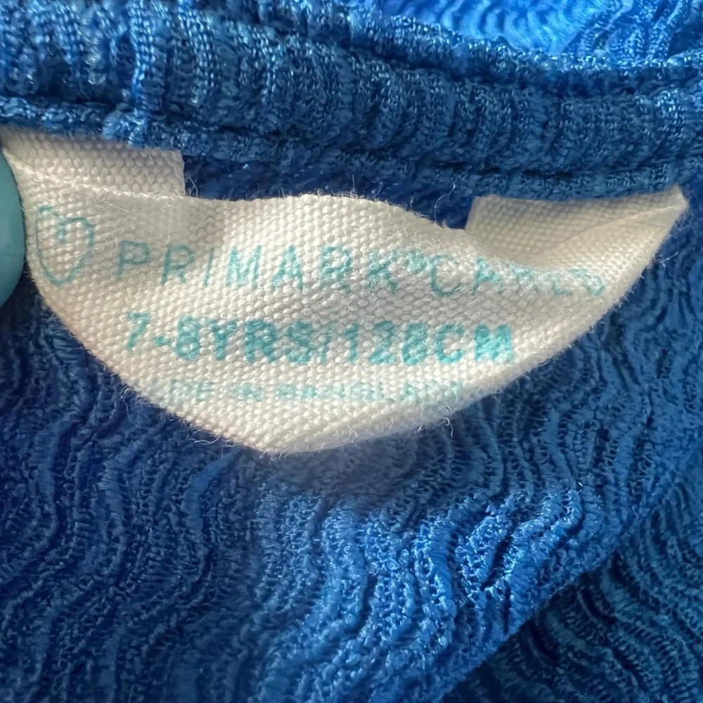 Primark royal blue textured jumpsuit with round neck and flutter sleeves